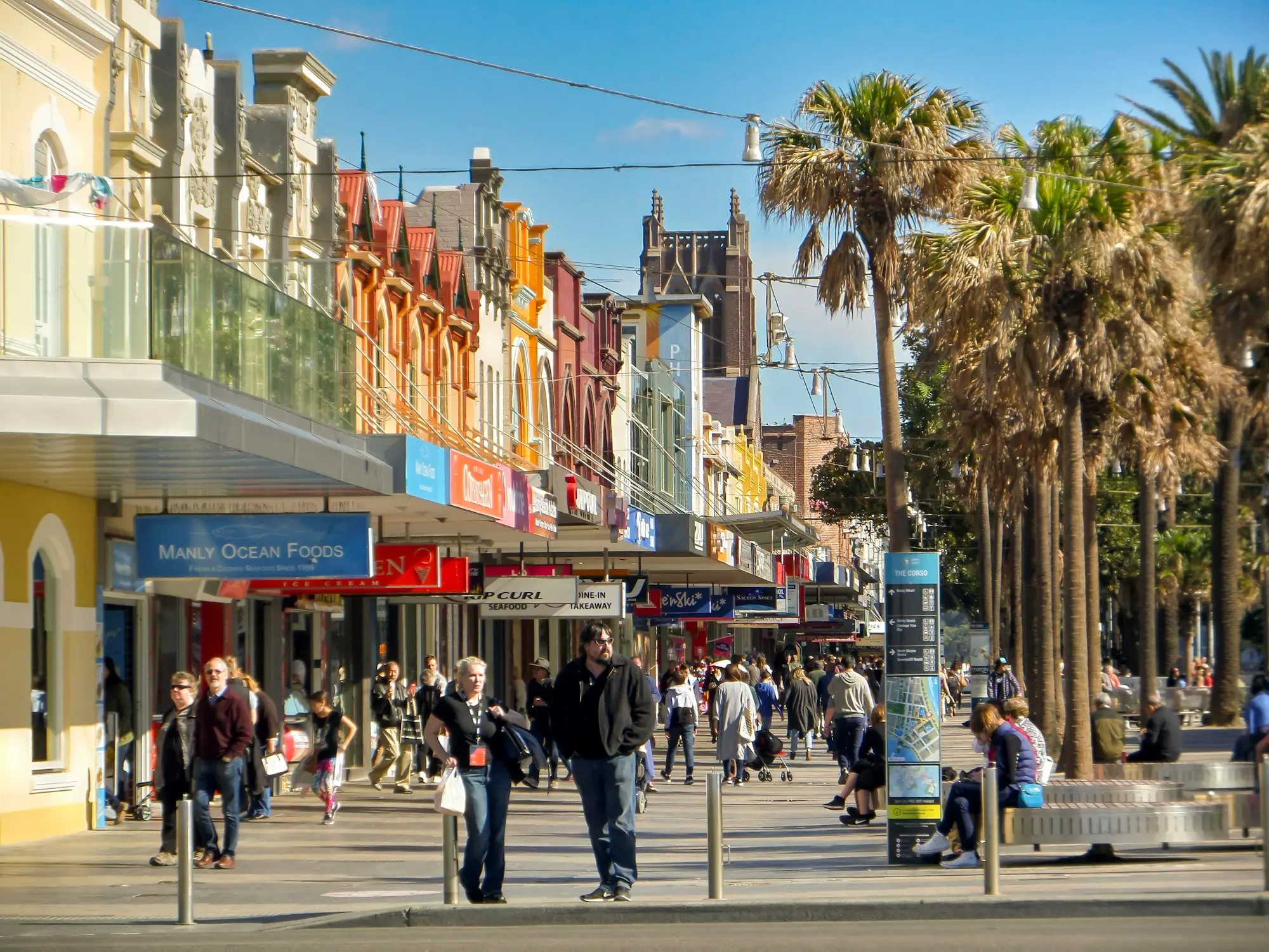 Shops and palm trees along the Corso in Manly, Sydney