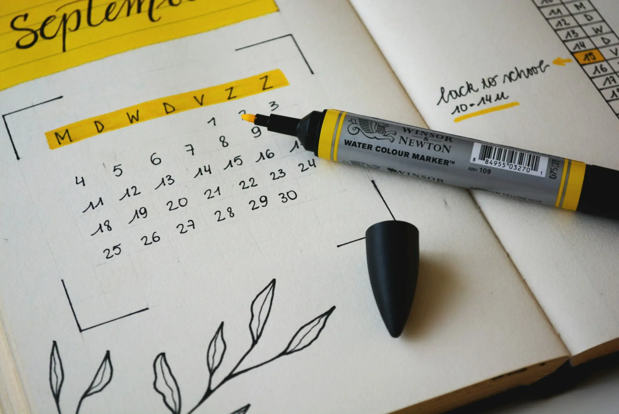 Monthly calendar being planned with a highlighter