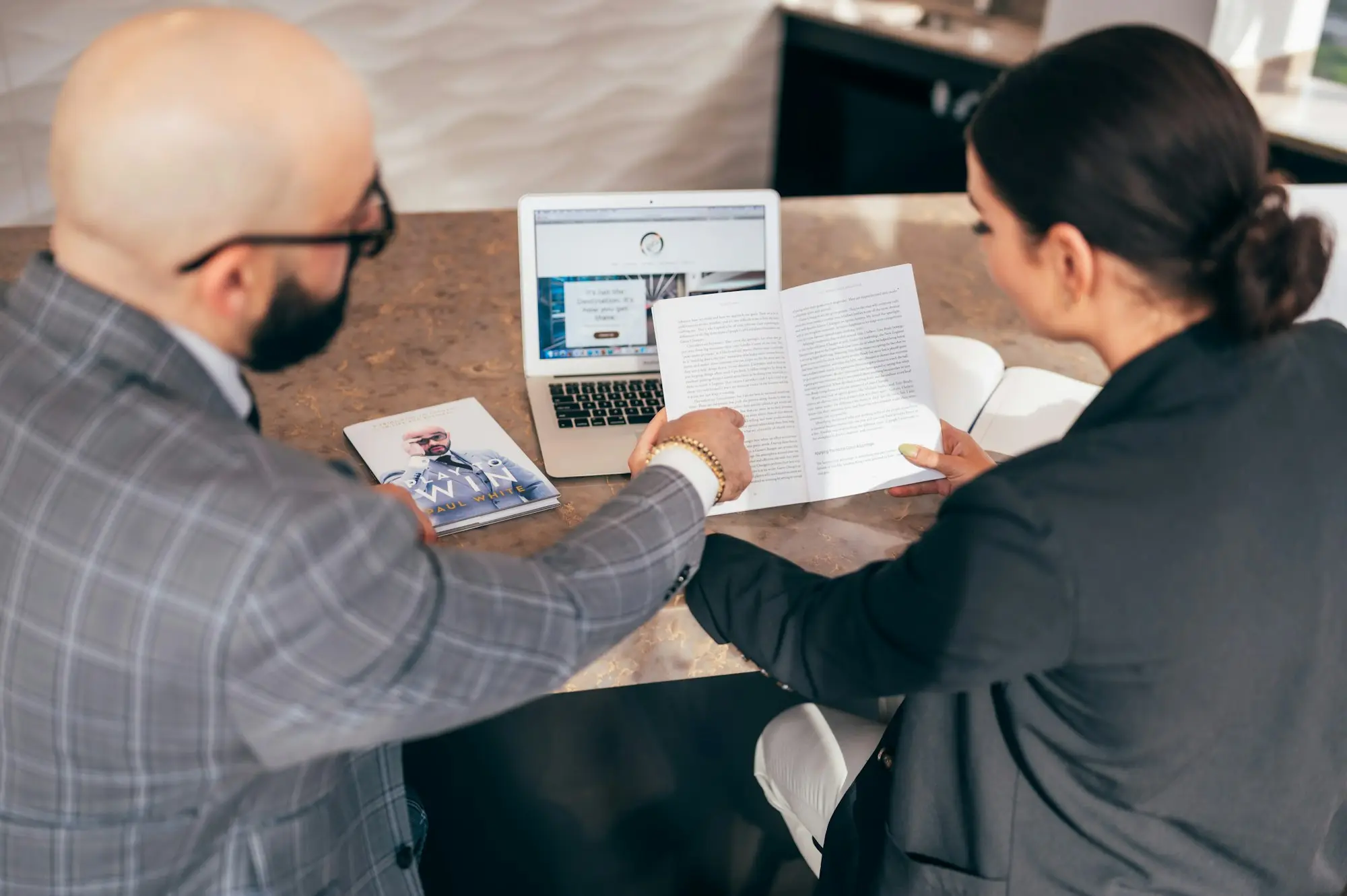 Business owner reviewing a tax bill with an accountant